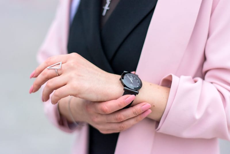A smart ring worn on a finger, close up
