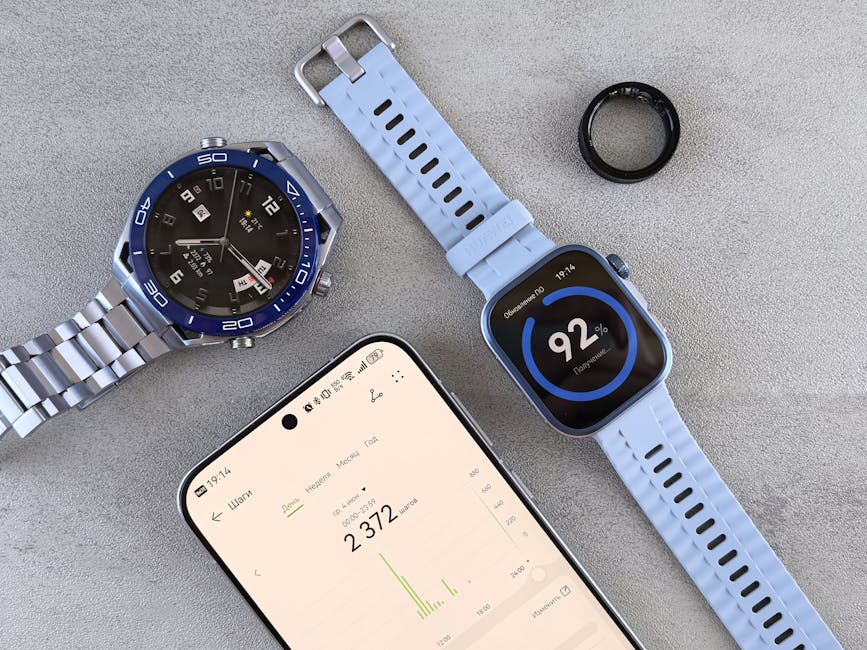 A smartwatch and a smart ring side by side displaying fitness data