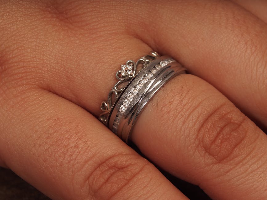 Close-up of a smart ring on a finger, illustrating the snug-but-not-tight fit that consumer-ring sensors need for reliable heart-rate and HRV readings