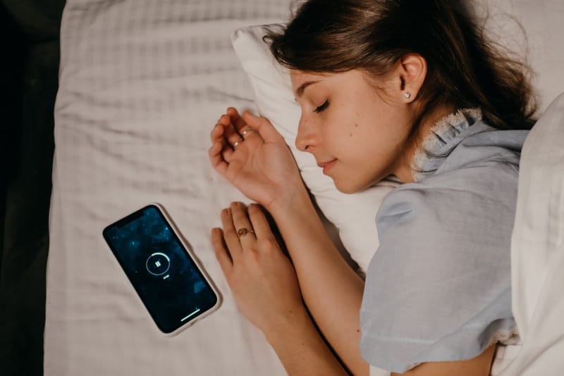 Sleep tracking data displayed on a smartphone app at night